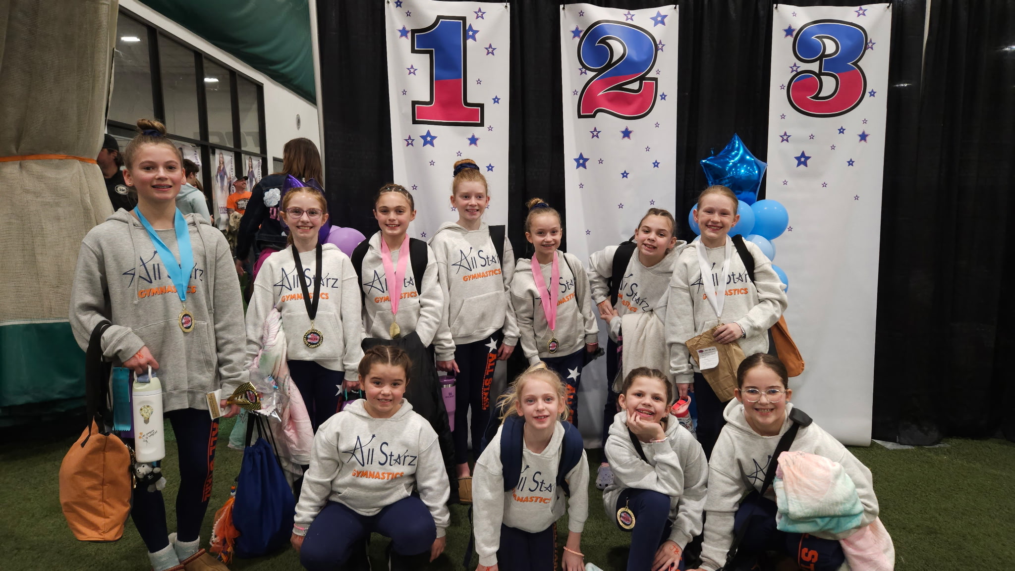 Optional gymnasts together at a competition